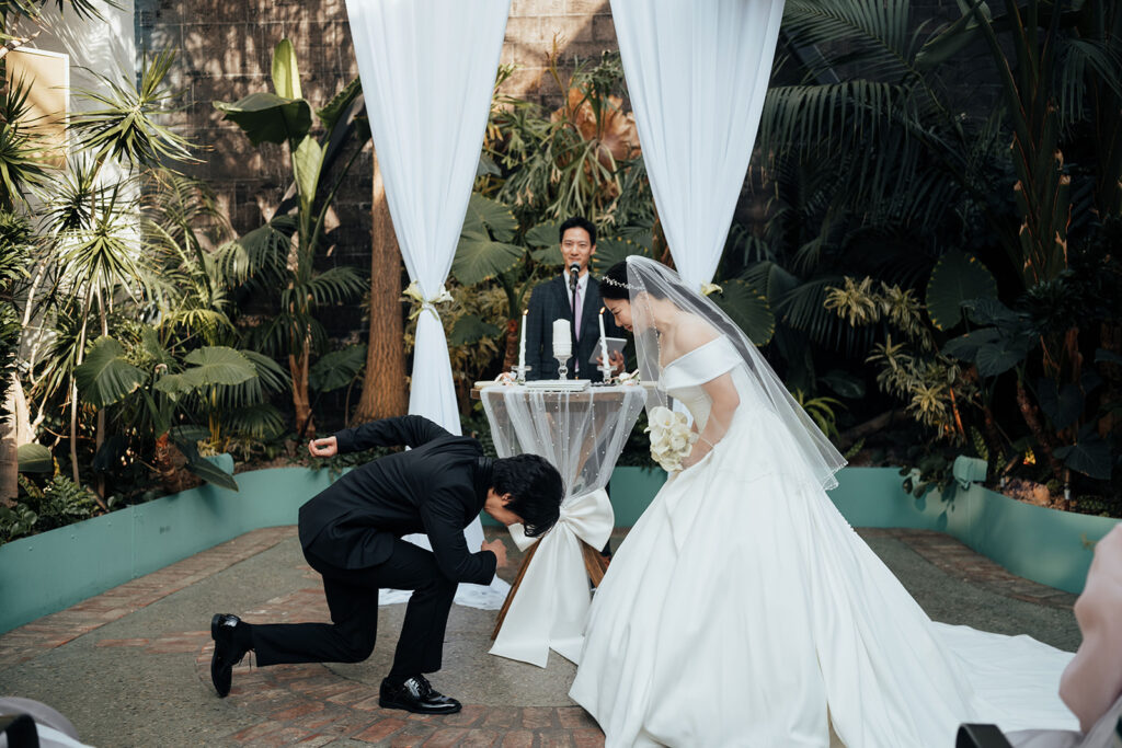 Couple bowing to each other during ceremony at the Grassroom DTLA