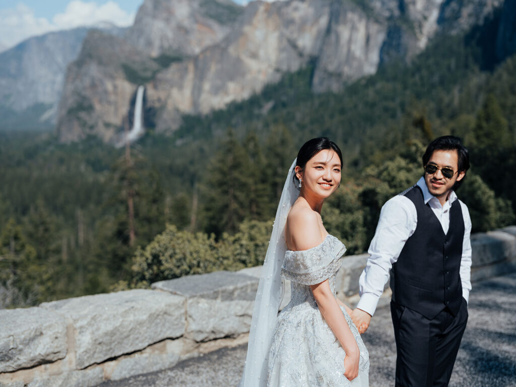 A newly wed strolling around Yosemite National Park just before their Adventure Wedding.