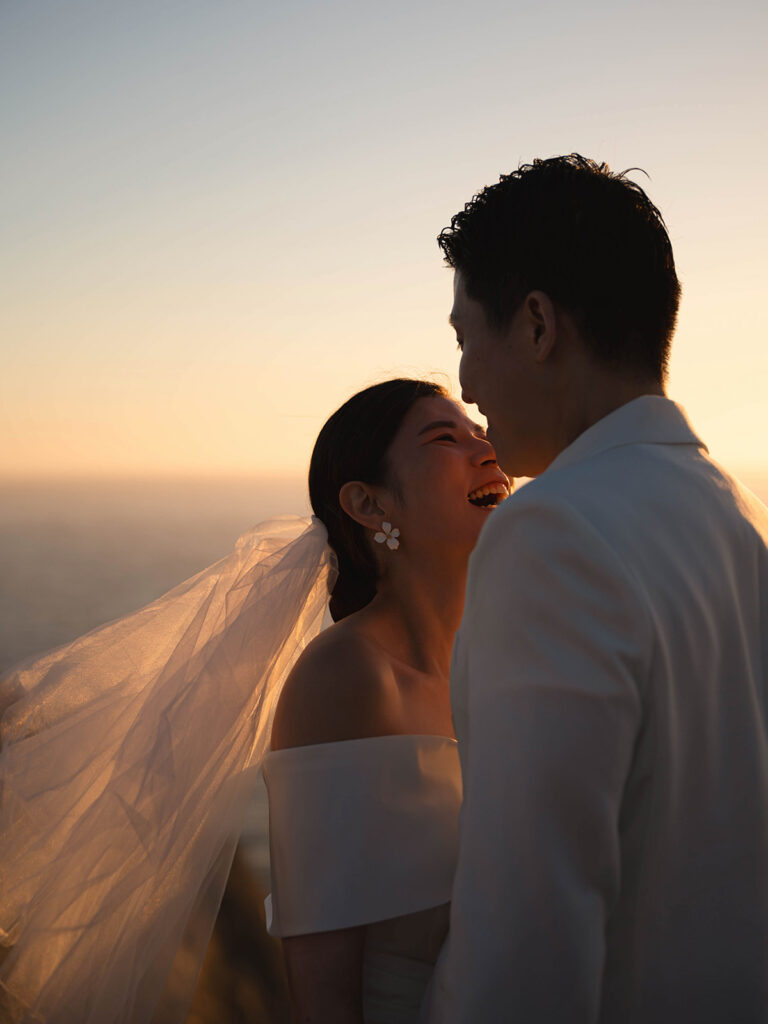 Couple watching the sunset after their malibu eloepment