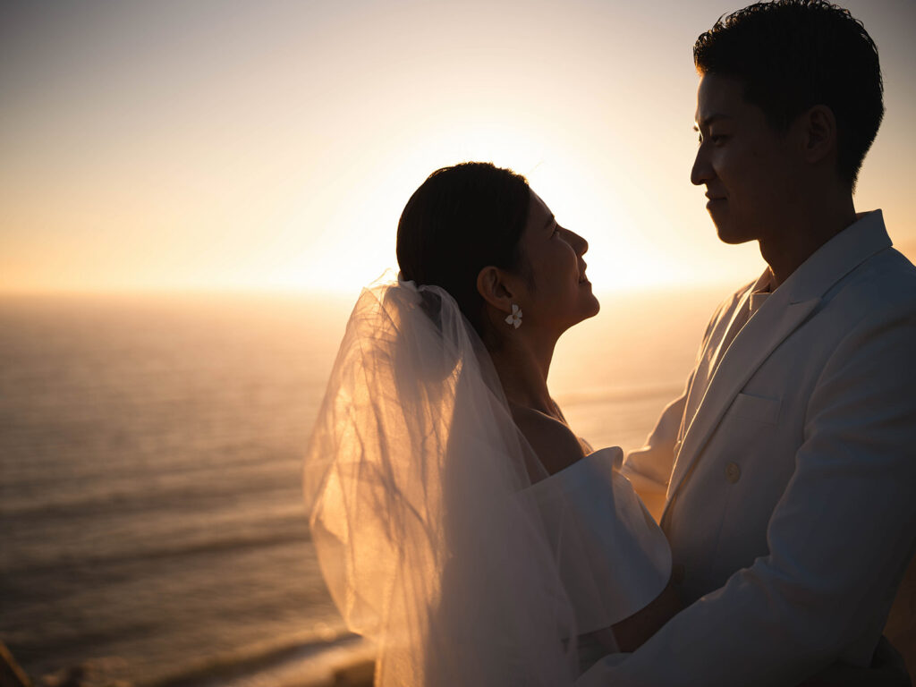 Couple watching the sunset after their malibu eloepment