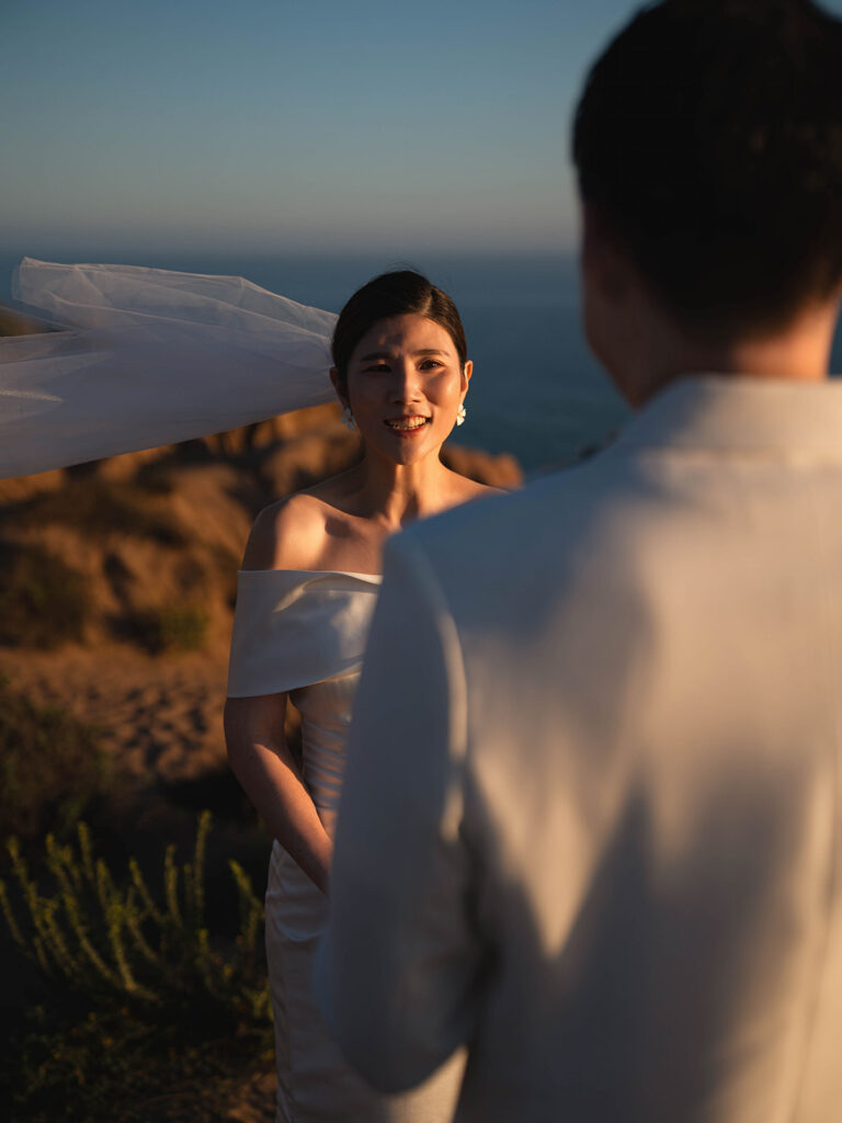 Couple reading vows to each other at their Sunset Malibu Elopement