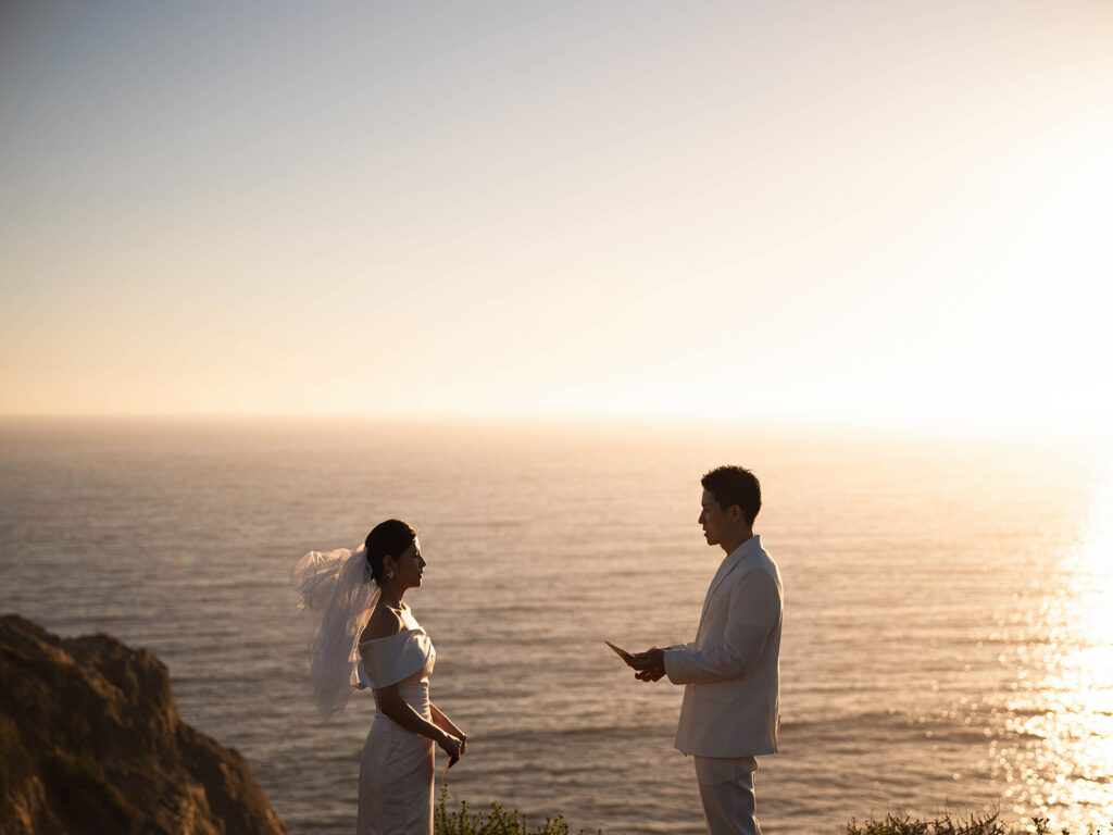 Couple reading their vows during their malibu eloepment