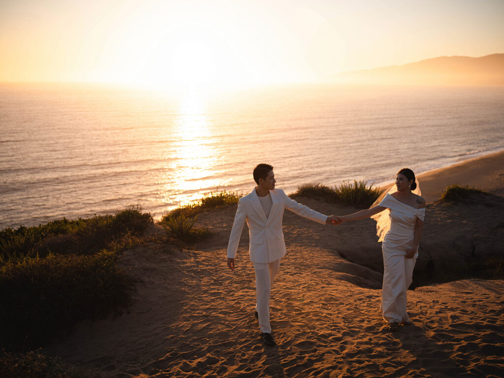 Couple watching the sunset after their malibu eloepment