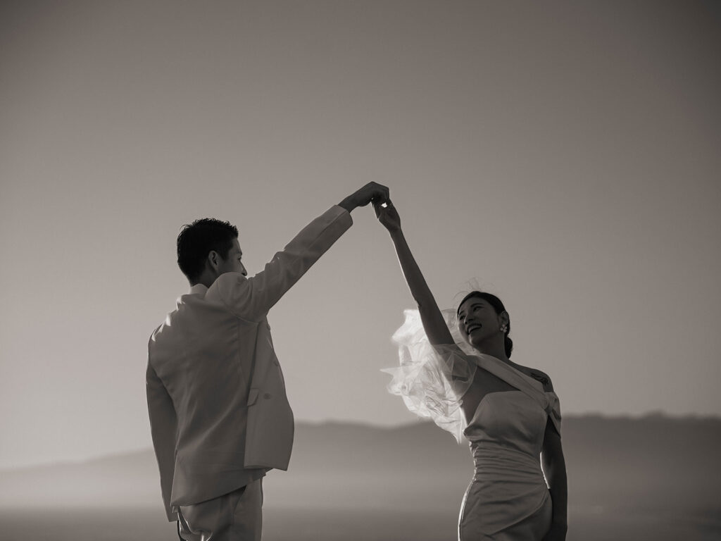 Couple watching the sunset after their malibu eloepment