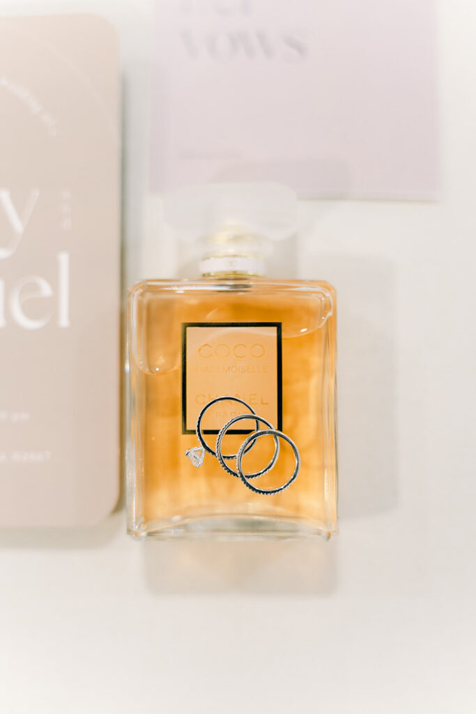 Wedding Timeline Without a Planner: Detail shots of wedding rings and wedding invitations