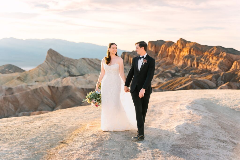 Wedding couple at Zabriskie Point in Death Valley at golden hour
