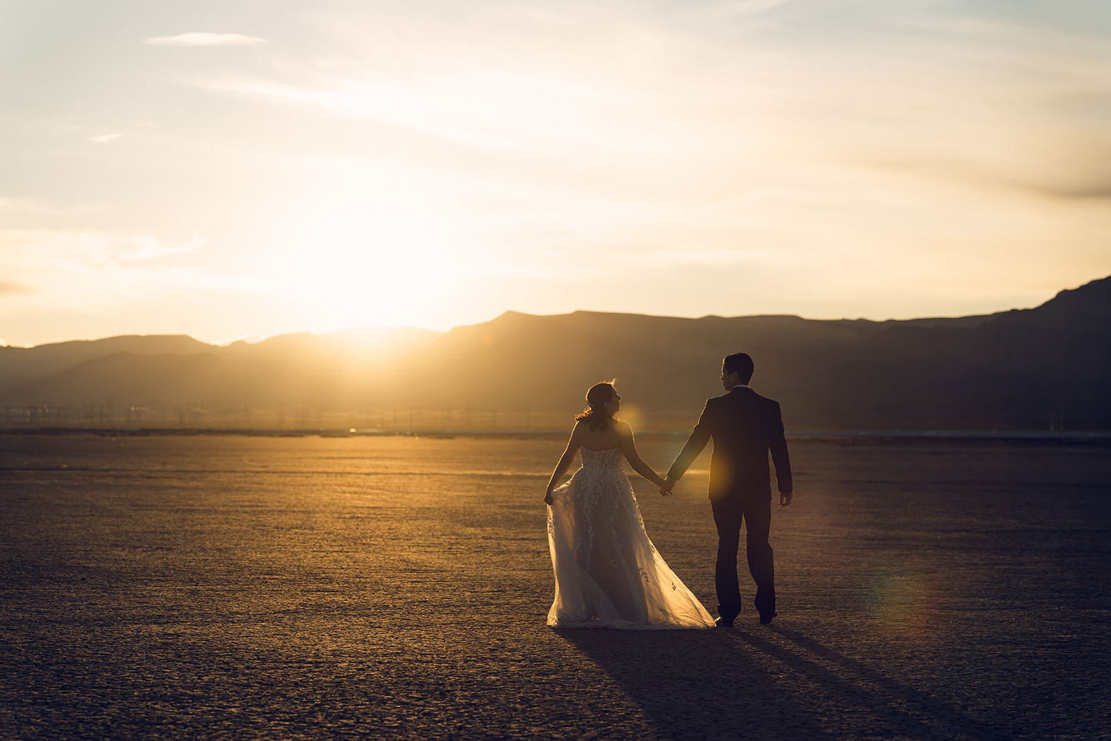 Las Vegas wedding photographer captures couple embracing in the desert at golden hour