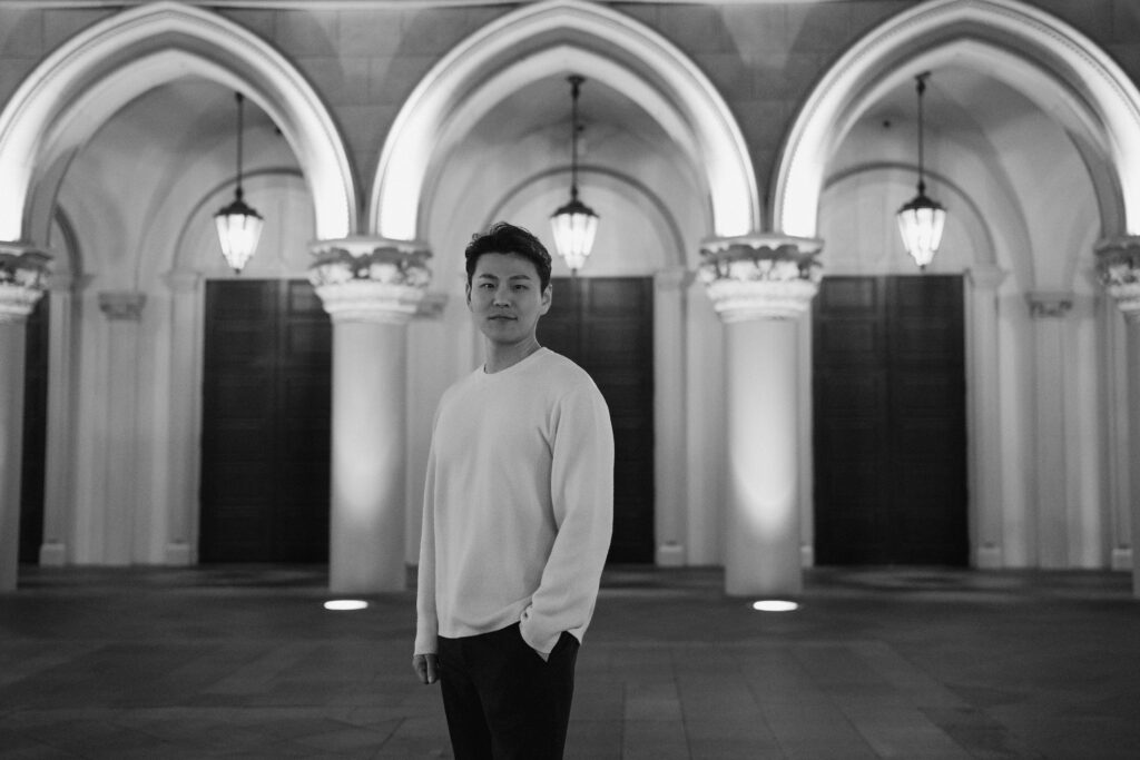 Black and white portrait under the Venetian arches during a Las Vegas engagement session